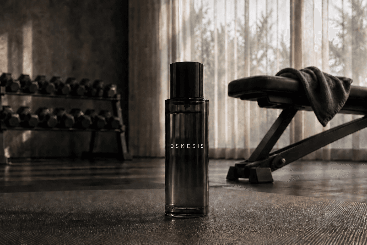 A bottle of Oskesis fragrance in a gym