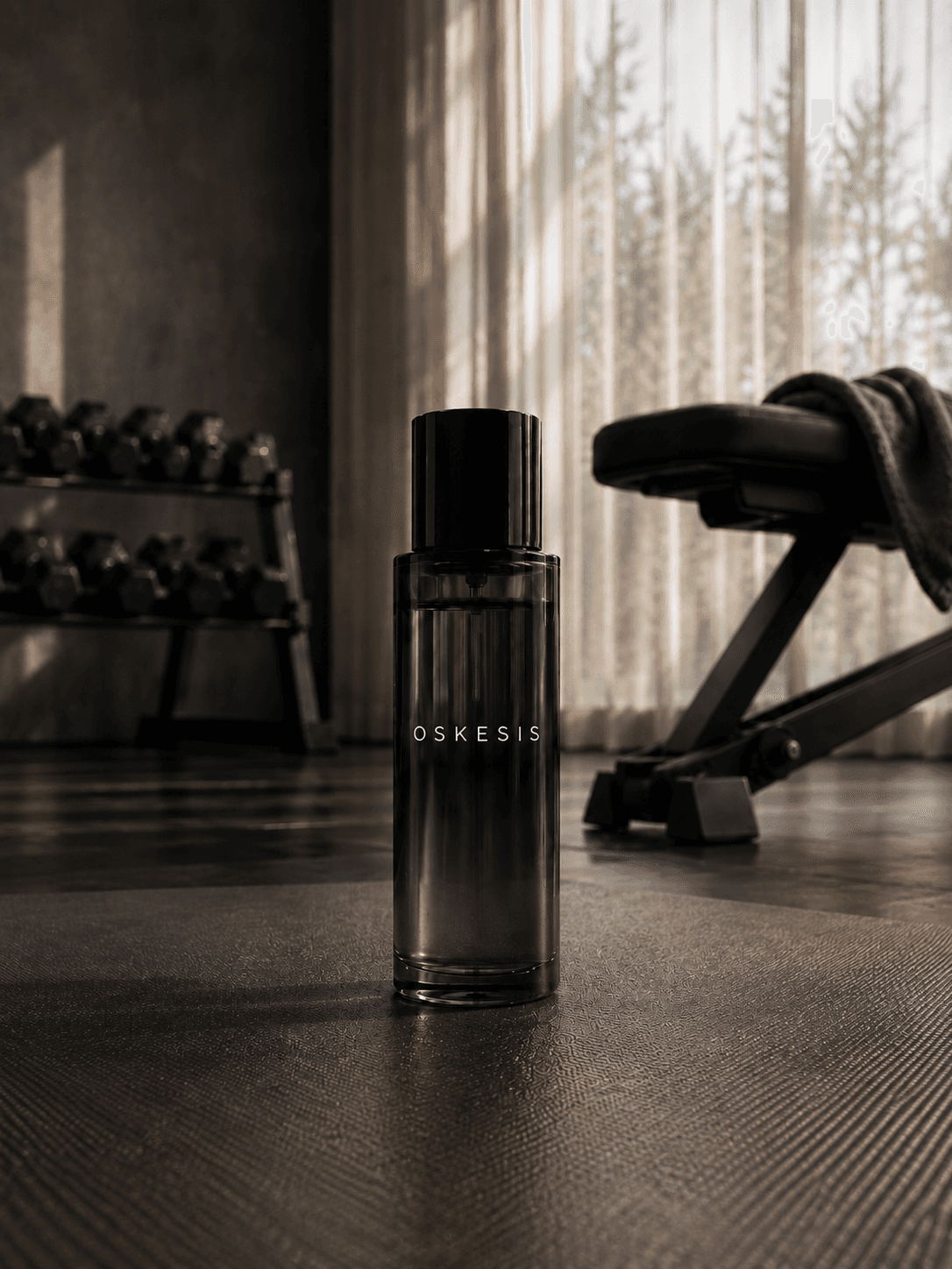 A bottle of Oskesis fragrance in a gym